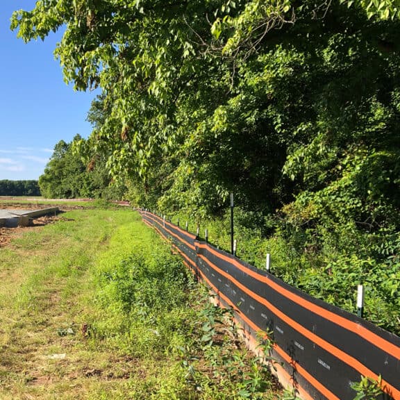 SMARTfence Heavy Duty Silt Fence bordering a jobsite to ensure the nearby woodland is not polluted