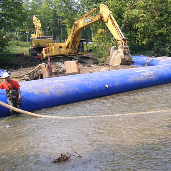 AquaBarrier lining a large body of water in order to help prevent flooding