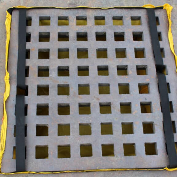 A fully-installed below-grate storm drain filter called the EconoSack