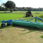 Radix Plastic Netting being rolled onto recently seeded ground using large machinery