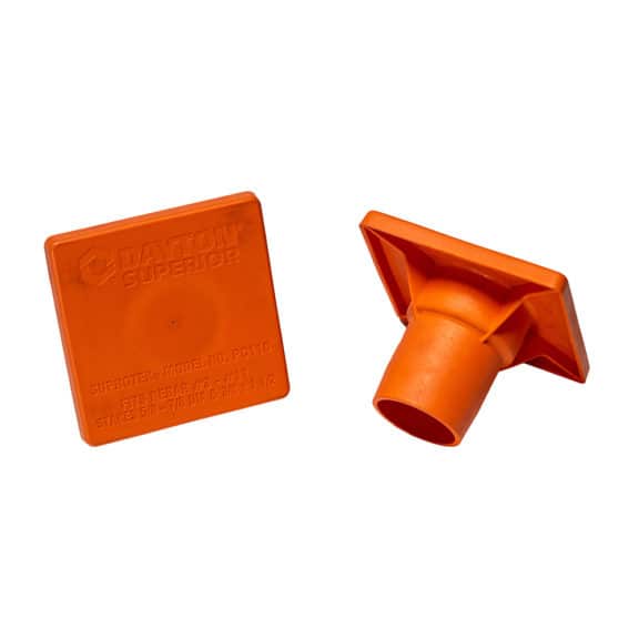 Two bright orange T Post Safety Caps