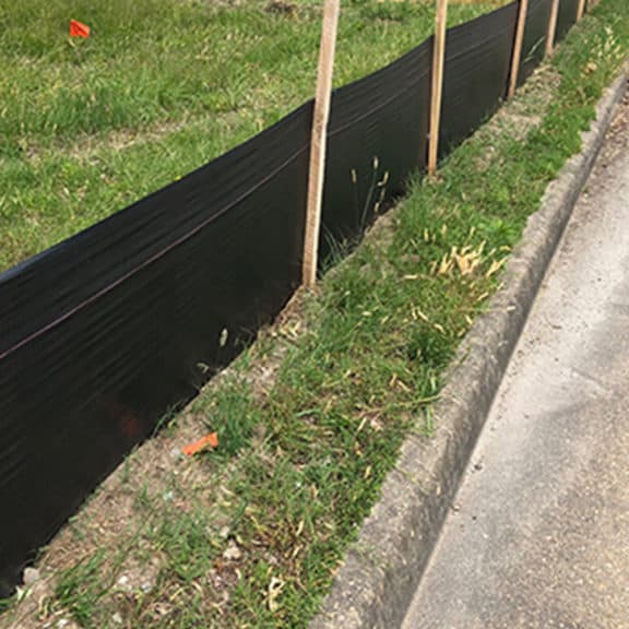 DOT Grade Silt Fence lining a road construction project
