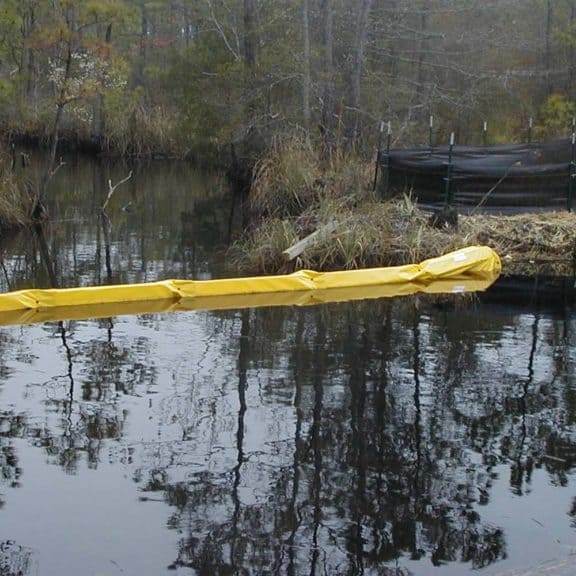 A floating turbidity barrier in a body of water near a construction site