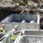 Stormwater management experts constructing a high-flow horizontal stormwater solution