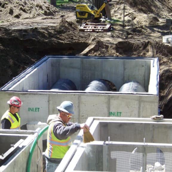 Stormwater management experts constructing a high-flow horizontal stormwater solution