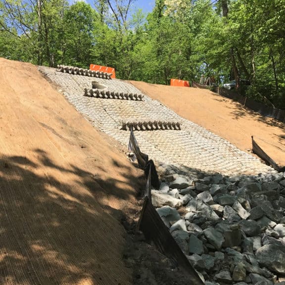Hard Armor installation on a large slope to mitigate hydraulic stresses
