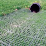 A newly laid transition mat that was laid in a ditch at the outlet of a pipe