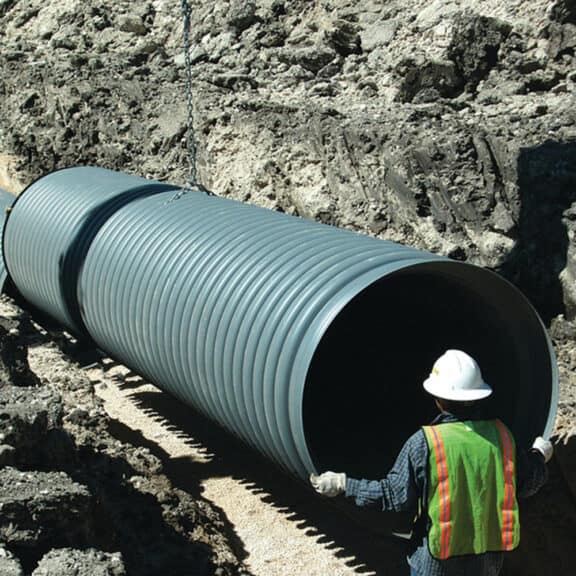 Large HP Storm Pipe being prepped for installation