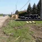 A stack of N-12 Dual Wall Corrugated pipe ready for installation